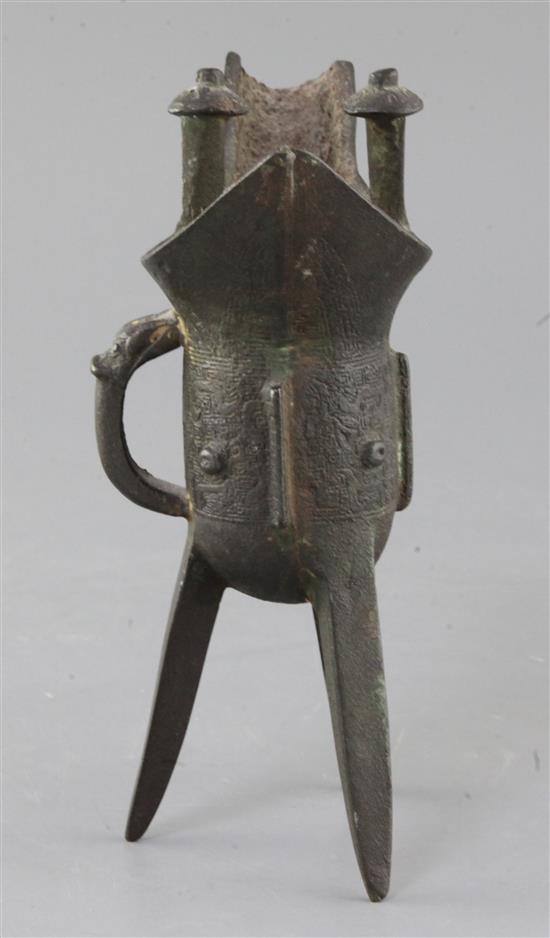 A Chinese archaic bronze wine vessel, Jue, Shang dynasty or later, 19cm high